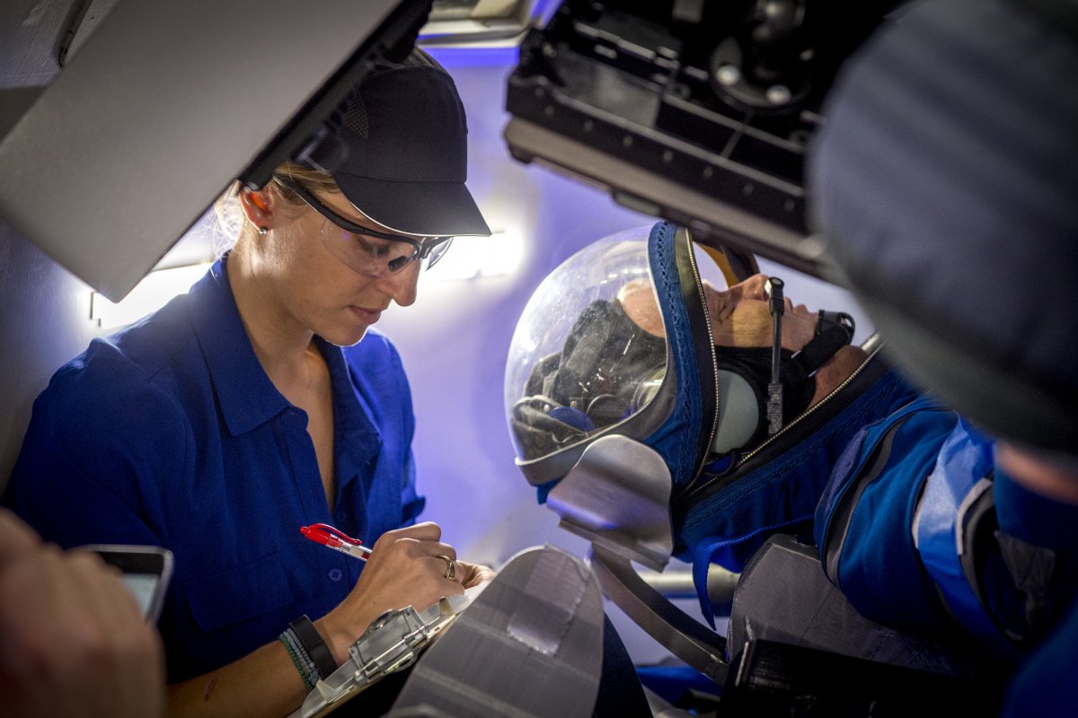 a boeing worker works with boe during a test