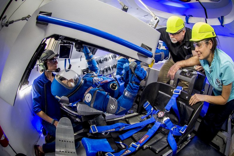 a boeing worker works with boe during a test