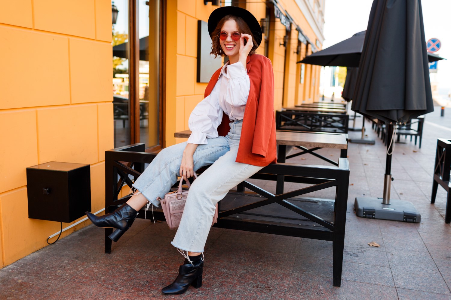 Street fashion look.  Amazing stylish traveling  girl in  trendy autumn outfit  posing outdoor .